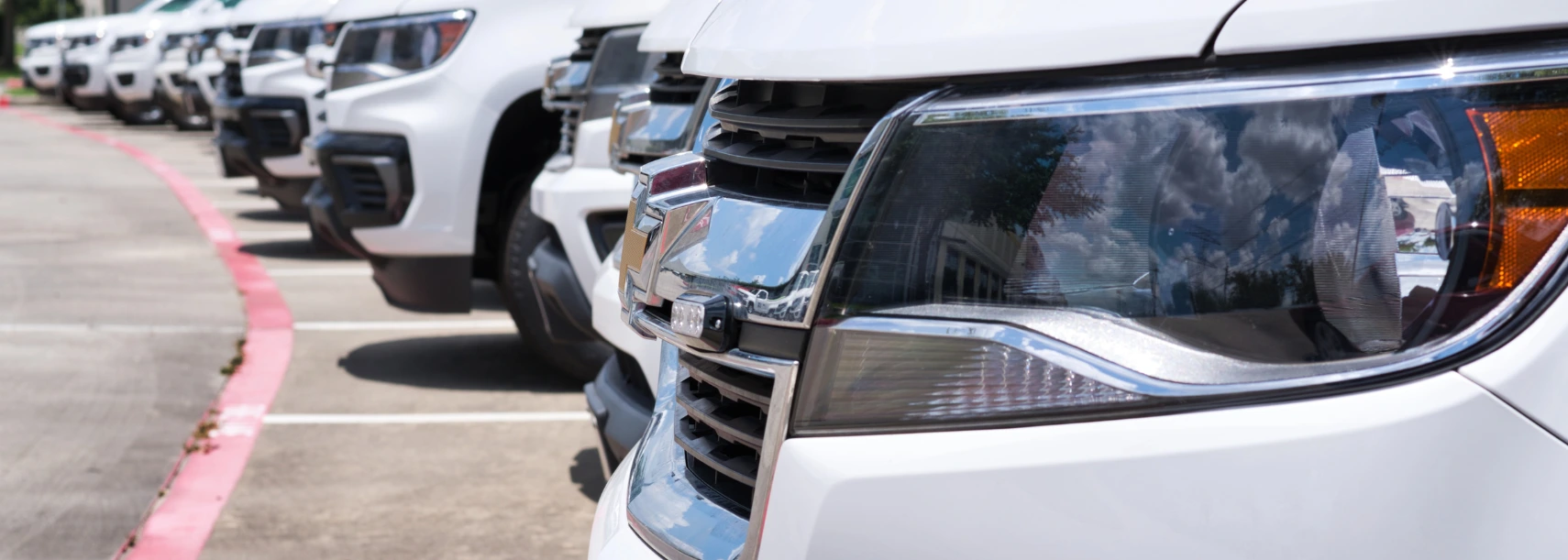 fleet maintenance, auto & truck services in Westfield, MA at LaFlamme's Auto & Truck Services. White vehicle fleet parked in a lot.