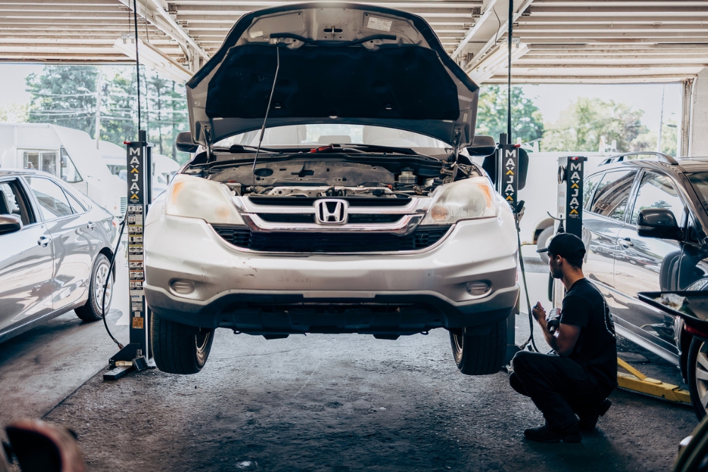 Vehicle Maintenance In Westfield, MA At LaFlamme's Auto & Truck Services. Car in auto shop for vehicle maintenance service.