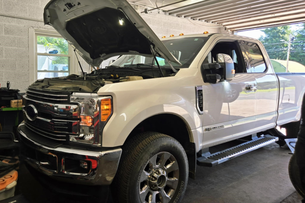Pre-Purchase Inspection in Westfield, MA At LaFlamme's Auto & Truck Services. Image of Vehicle undergoing pre-purchase inspection at an auto repair shop